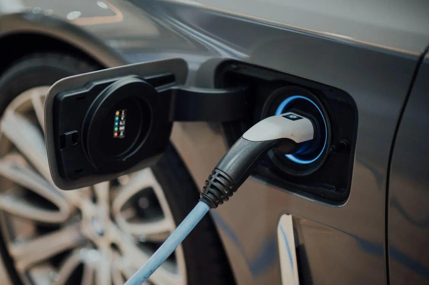 An electric vehicle connected to a charger