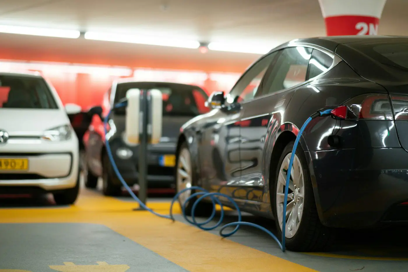 Electric cars plugged into chargers